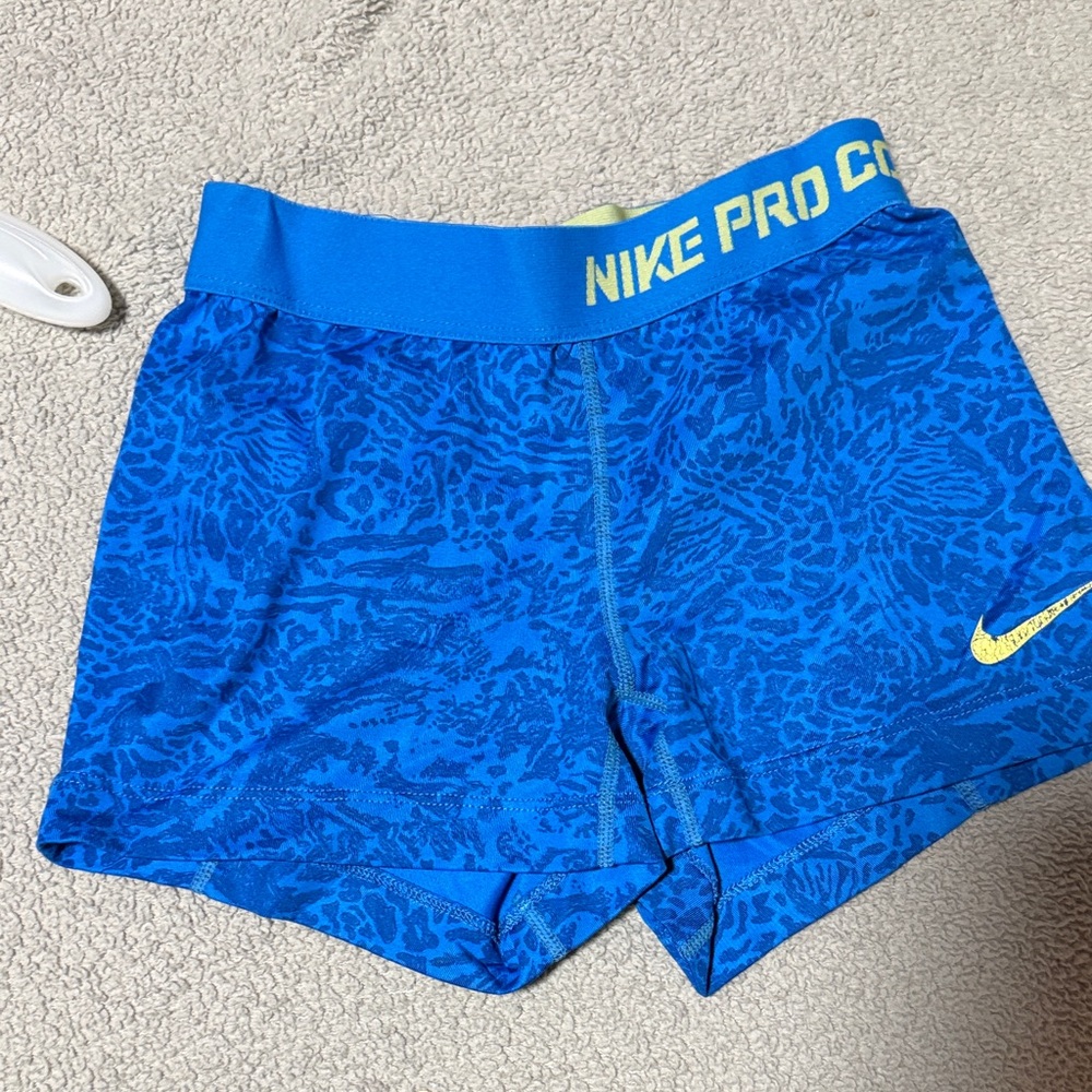 Nike Pro Blue Patterned Athletic Shorts with Yellow Logo